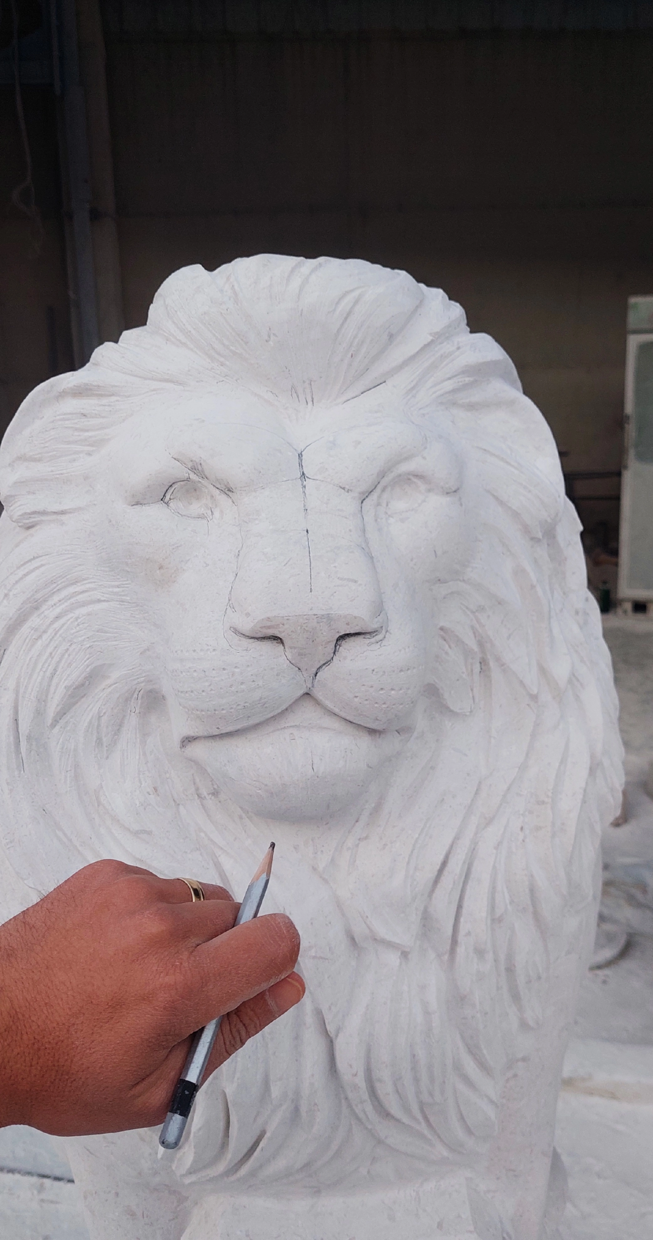 Lion head sculpture in stone